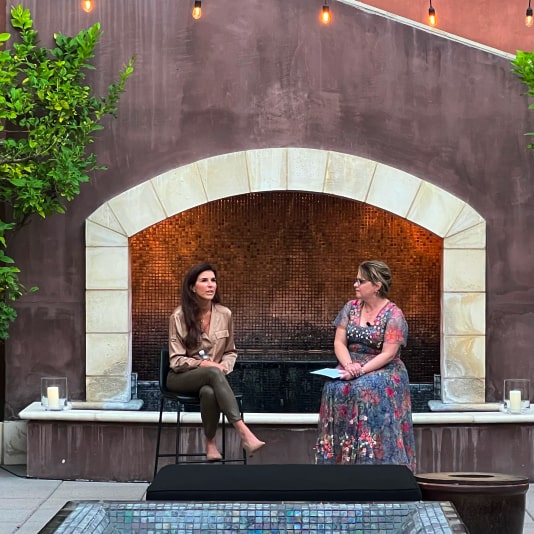 Kelley sitting on fountain